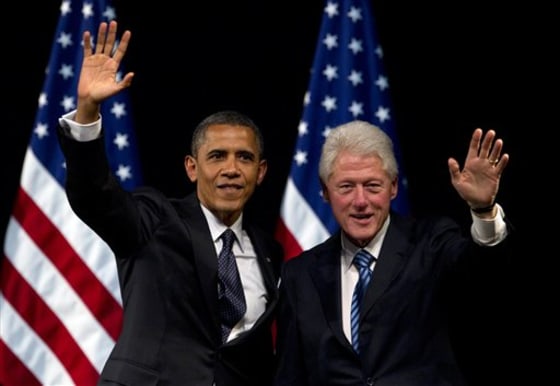 President Barack Obama and former President Bill Clinton wave to the crowd during a campaign event at the New Amsterdam Theater in New York. (AP Photo/Carolyn Kaster, File)